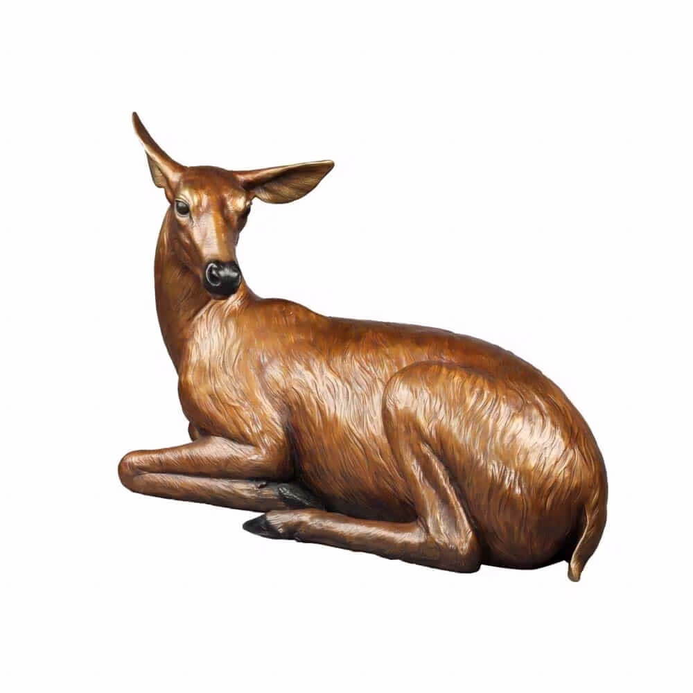 Lifelike bronze Outdoor Deer Sculpture showing a resting doe