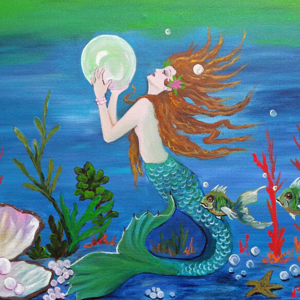 Mermaid holding a glowing pearl underwater