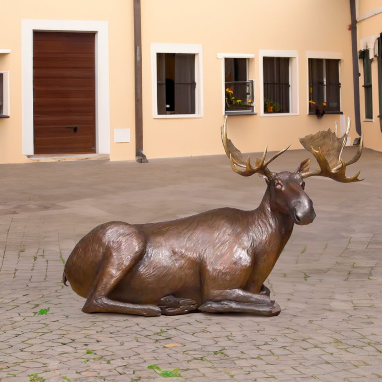 Outdoor Moose Life Size Statue featuring a life-like seated moose with large antlers
