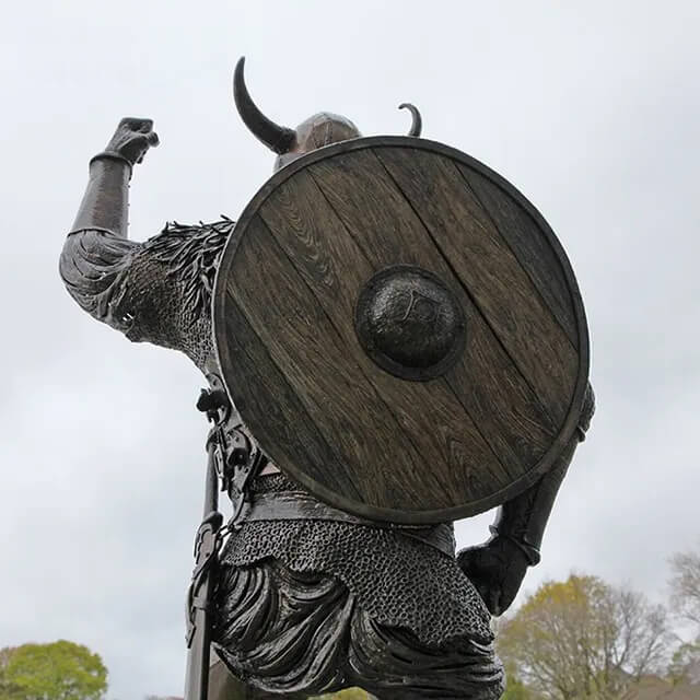 Rear view of Viking Garden Statue showing the detailed wooden round shield