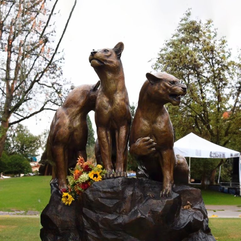 Close-up of bronze Lionesses Statue showing one roaring, and one facing forward in tribute composition