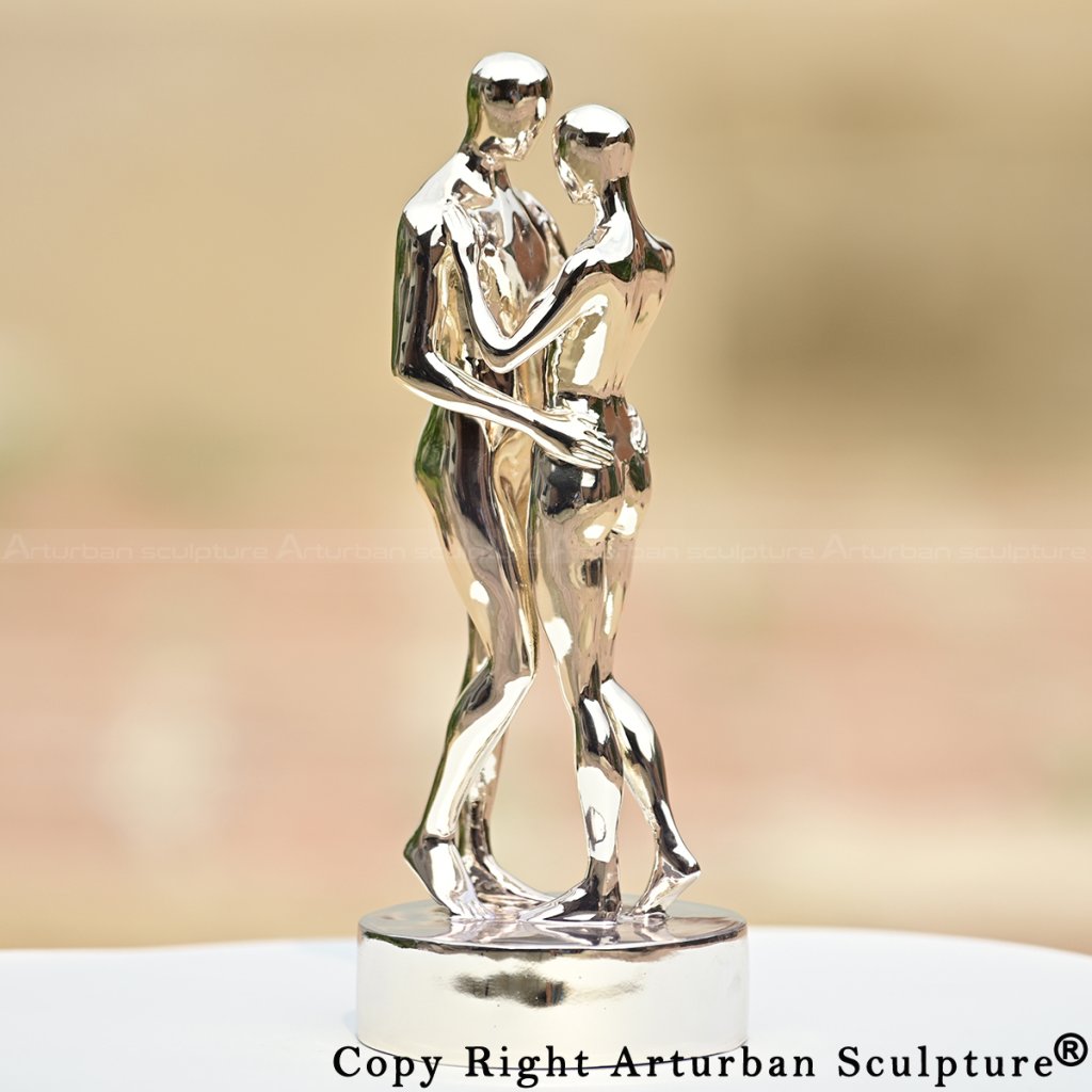Polished stainless steel couple embracing statue, inspired by In Every Lifetime I Will Find You