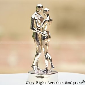 Polished stainless steel couple embracing statue, inspired by In Every Lifetime I Will Find You