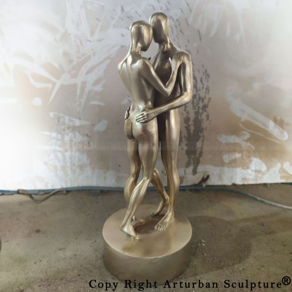 Electroplated couple embracing statue