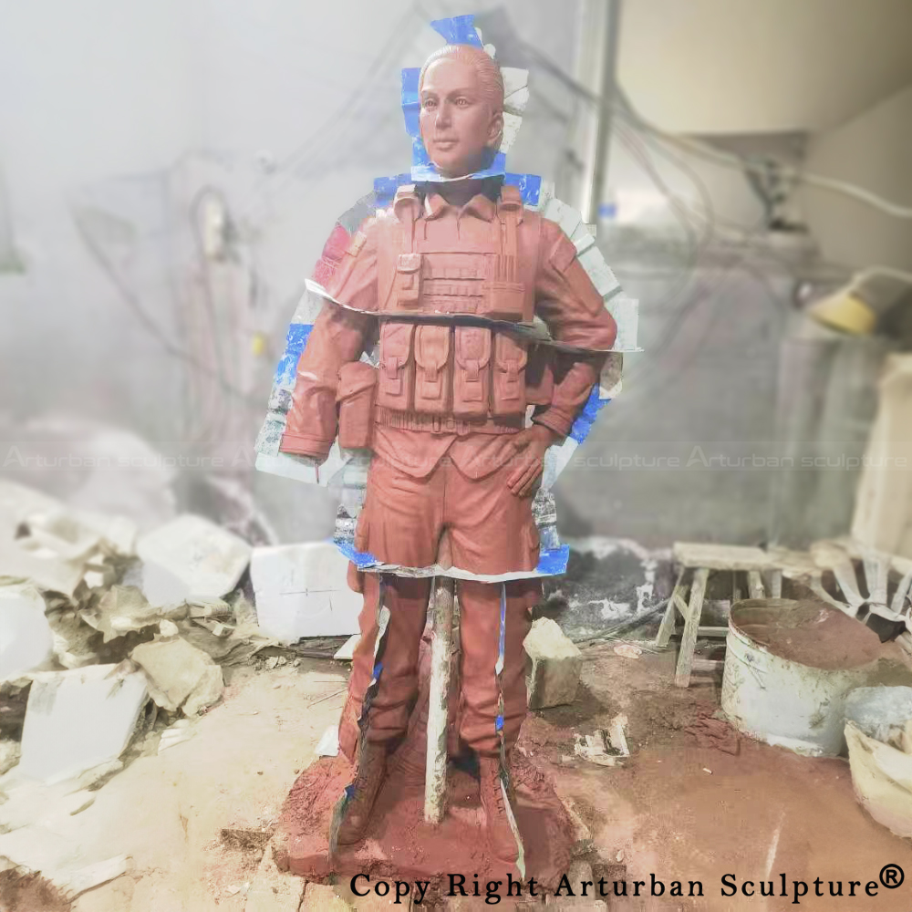 4-Female Soldier Statue clay model wrapped in mold material for bronze casting preparation