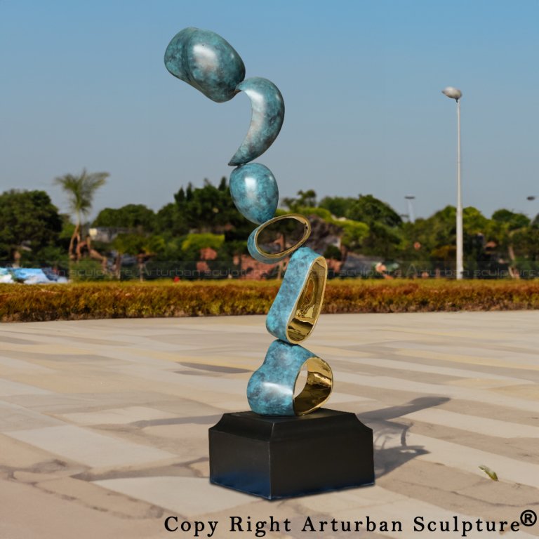 Abstract Art Statue made of stainless steel with blue-green patina and polished gold interior