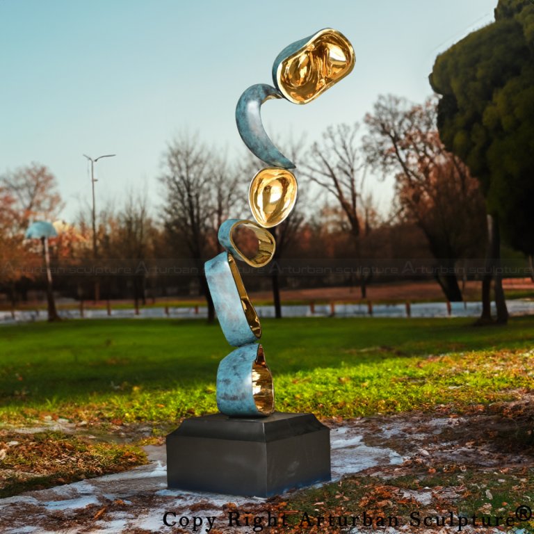 Abstract Sculpture DéCor in stainless steel with blue-green exterior and gold mirror interior