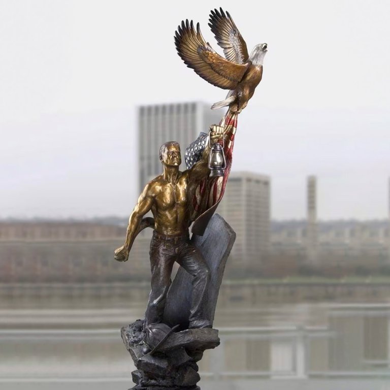Bronze 911 Memorial Sculpture showing man emerging from debris, holding lantern, with eagle soaring above and gripping American flag
