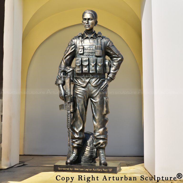 Bronze military statue of a female soldier in combat gear