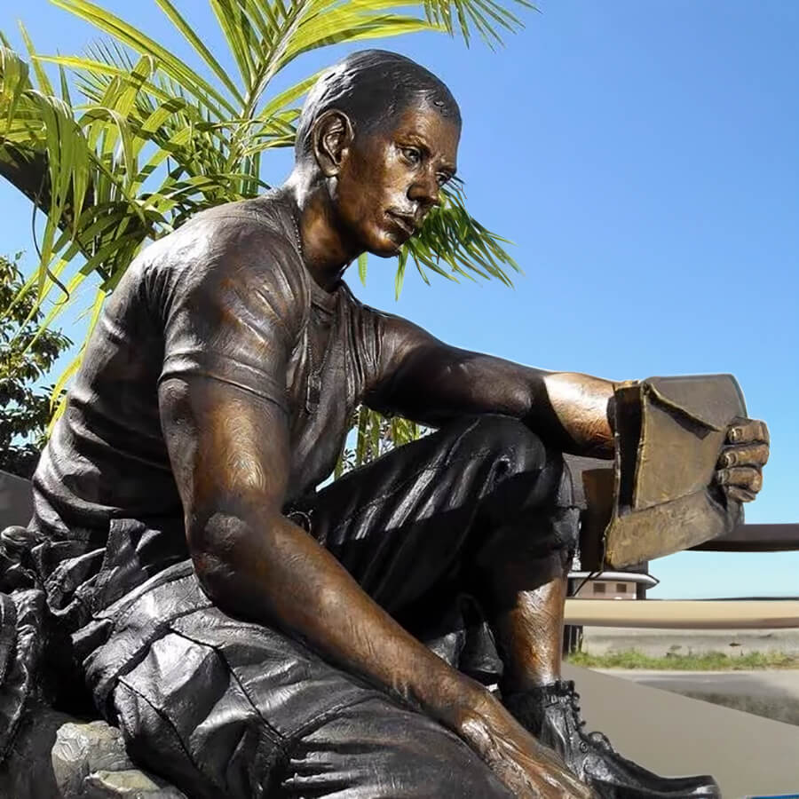 Close-up of the bronze Letters from Home Statue showing the soldier's expression