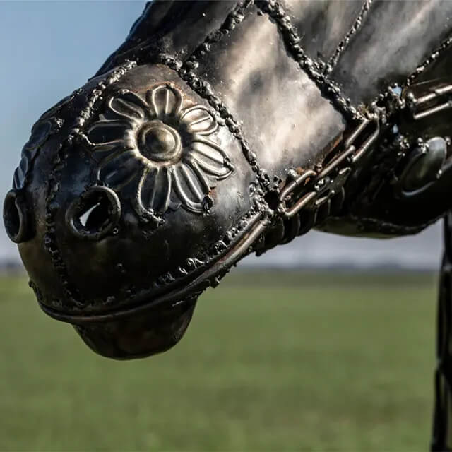 Close-up of the stainless steel steampunk horse's nose with flower engraving