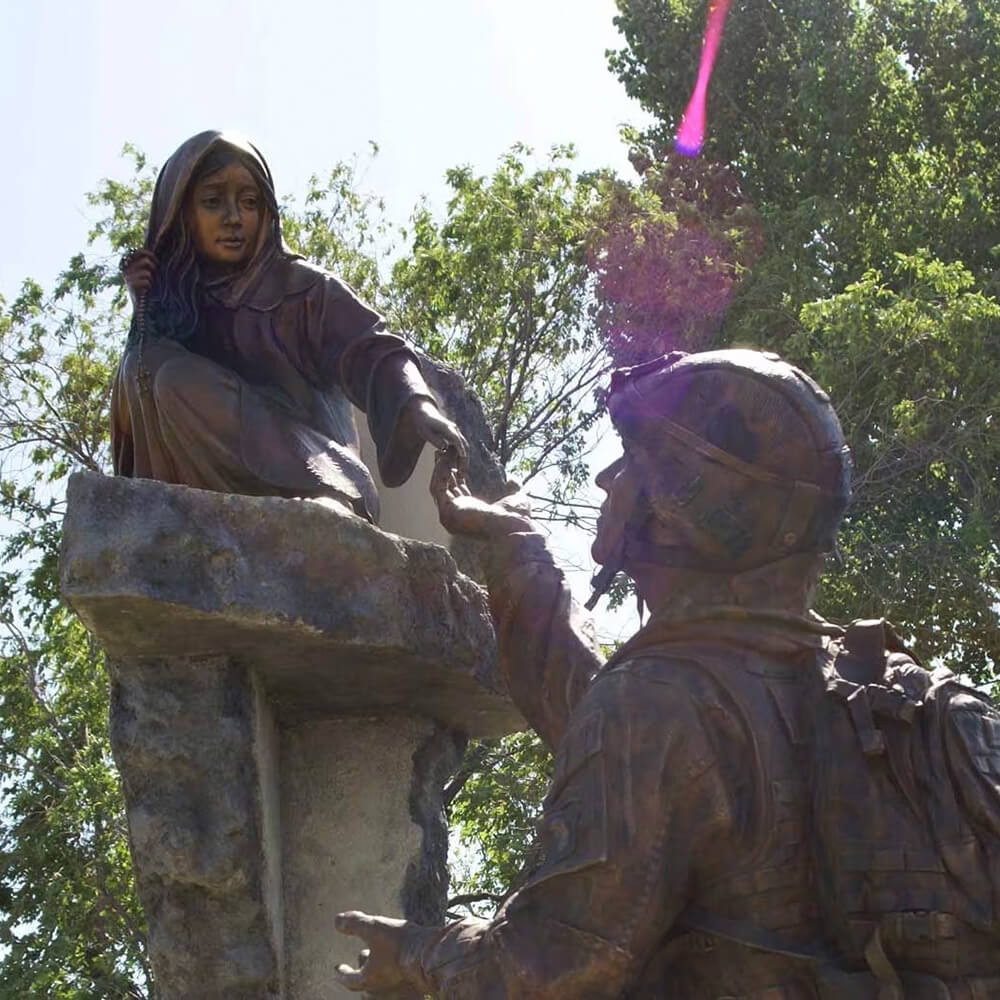 Detail of the girl in the soldier statue for garden, reaching out in a moment of hope