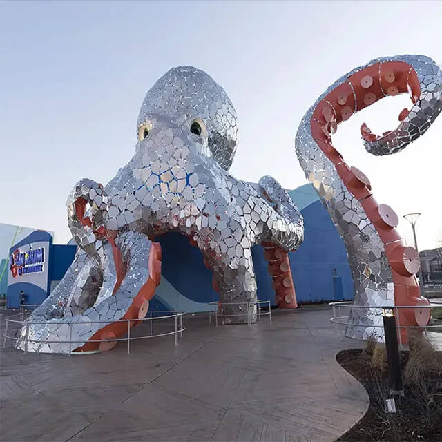 Giant Octopus Sculpture featuring stainless steel mirror panels and curving tentacles