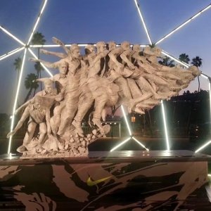 Motion in Sculpture bronze statue showing transformation from skateboarder to soccer player