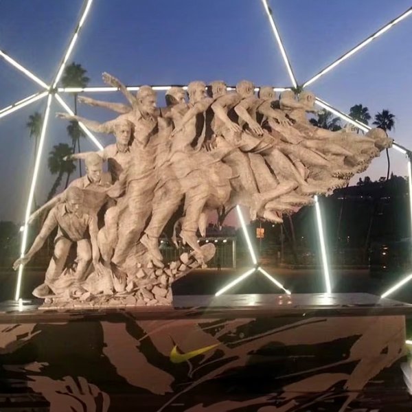 Motion in Sculpture bronze statue showing transformation from skateboarder to soccer player