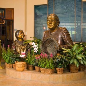Native American Female Statue with young girl beside Martha Jane bronze sculpture