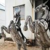 Rearing stainless steel horse sculptures