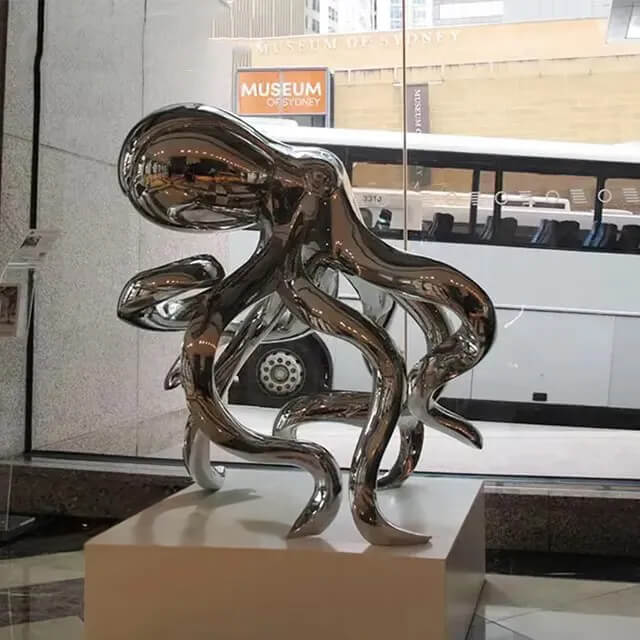 Stainless steel Silver Octopus Sculpture exhibited indoors