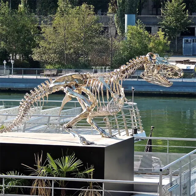Stainless steel T Rex Skeleton Statue featuring polished metallic bones and lifelike dinosaur structure