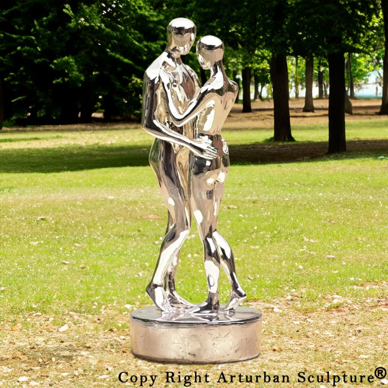 Stainless steel couple sculpture standing in a park