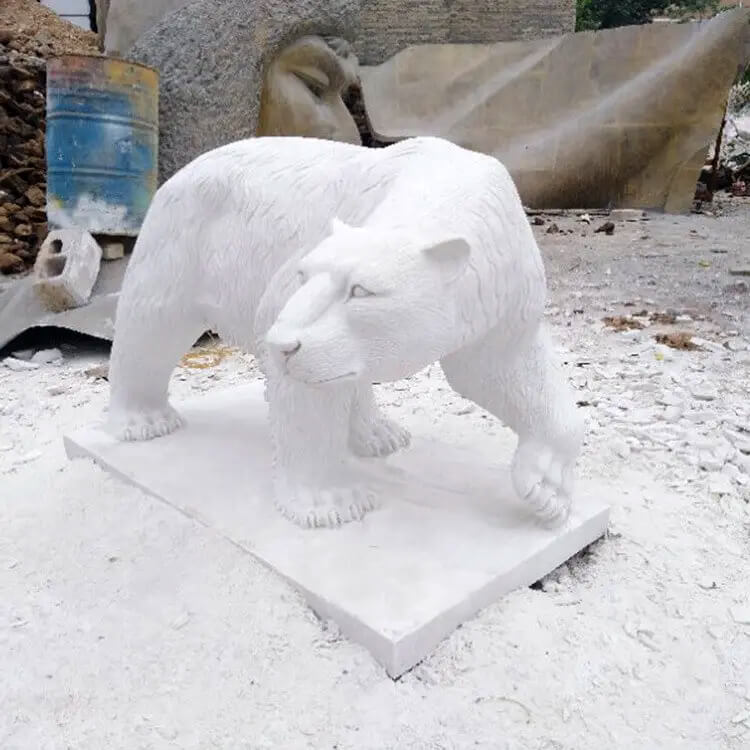 marble bear statue in alert walking motion