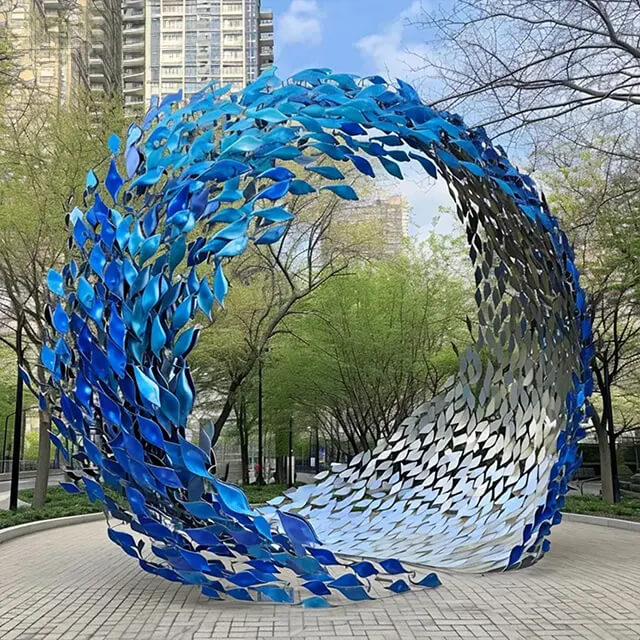 Blue stainless steel Shoal of Fish Sculpture arranged in a spiraling motion