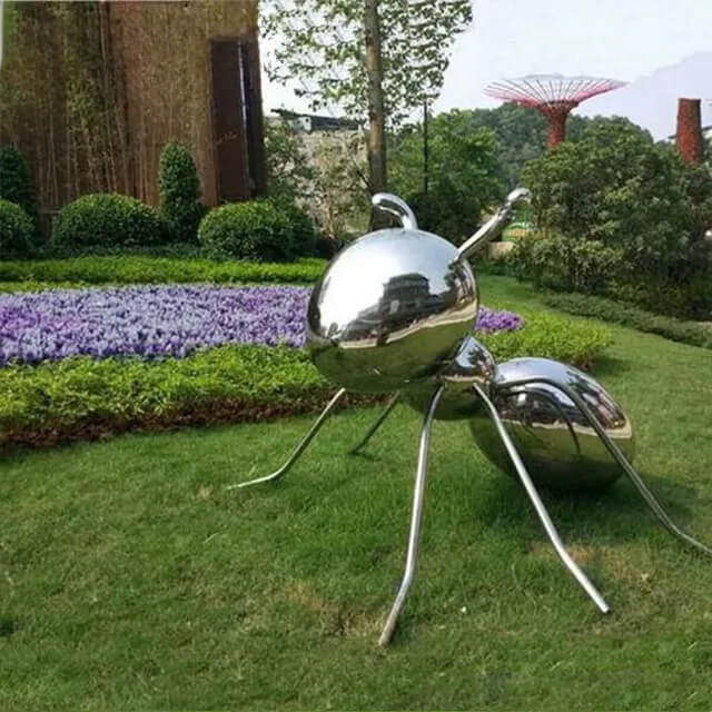 Large Metal Ant Yard Art Statue displayed on a green lawn
