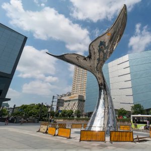Large stainless steel Whale Tail Sculpture rising
