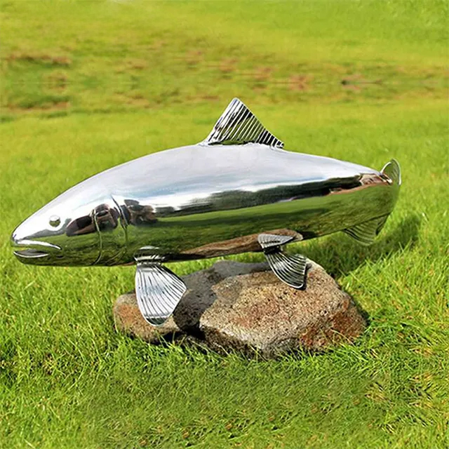 Metal Salmon Sculpture made of stainless steel displayed on a stone base