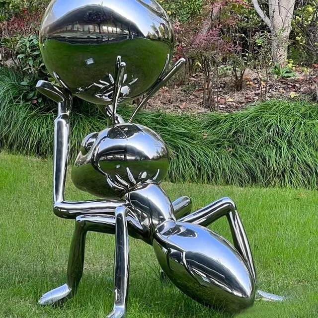 Polished stainless steel Ant Statue lifting a sphere