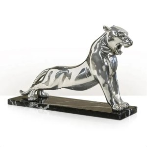 Shiny stainless steel Silver Panther Statue roaring on a marble base