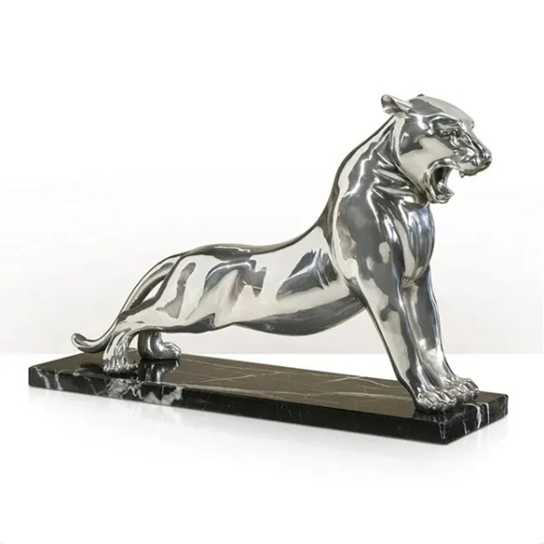 Shiny stainless steel Silver Panther Statue roaring on a marble base
