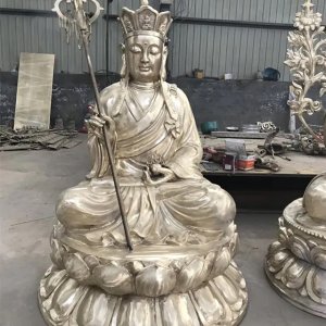 Stainless steel Dizang Statue depicting the Bodhisattva Kṣitigarbha in full ceremonial attire on a lotus pedestal
