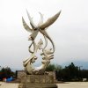 Stainless steel Phoenix Garden Statue featuring two abstract phoenixes in flight, with flowing lines and dynamic symmetry