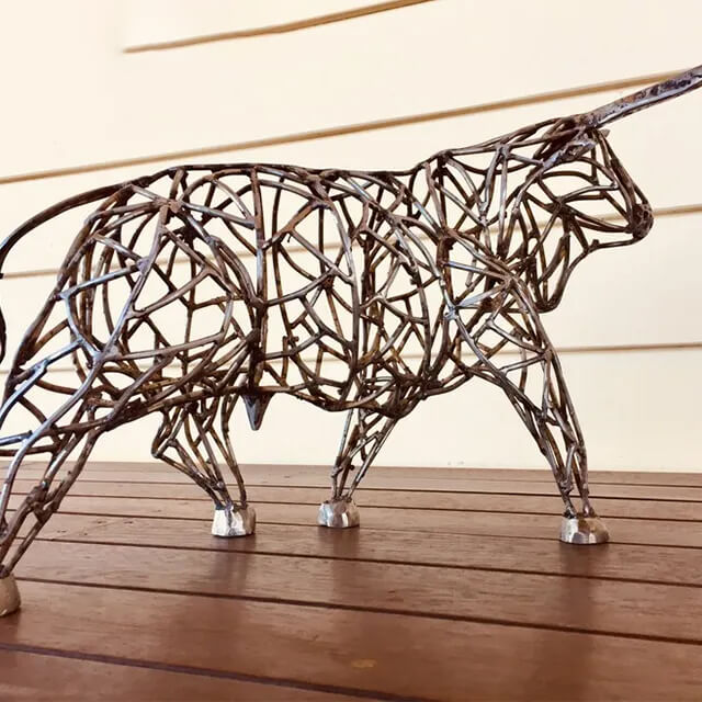 stainless steel Wire Bull Sculpture featuring intersecting metal rods