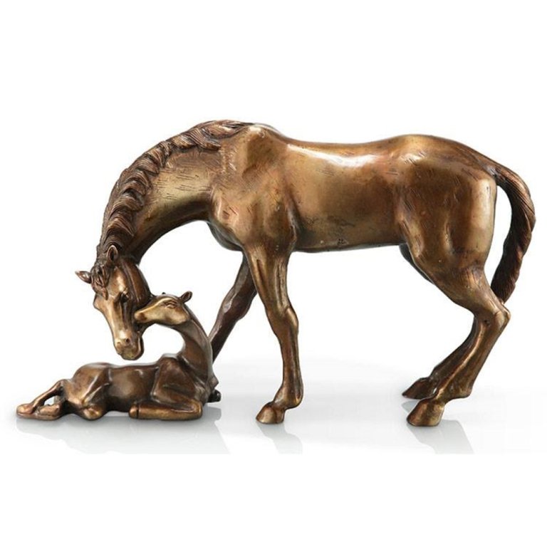 A finely detailed Mare and Foal Figurine crafted in bronze, showing a mother horse tenderly lowering her head toward her resting foal
