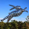 A large Bunny Foo Foo Statue made of stainless steel with a hollow design, showing a leaping rabbit