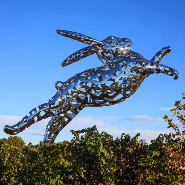 A large Bunny Foo Foo Statue made of stainless steel with a hollow design, showing a leaping rabbit