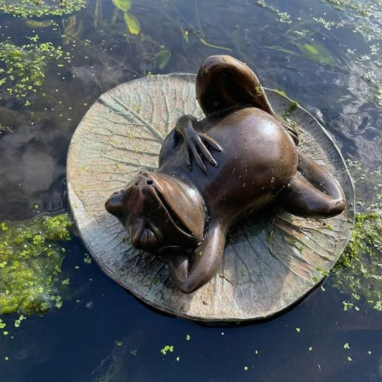 Bronze Frog on Lily Pad Garden Ornament showing a relaxed frog reclining on a detailed lily pad