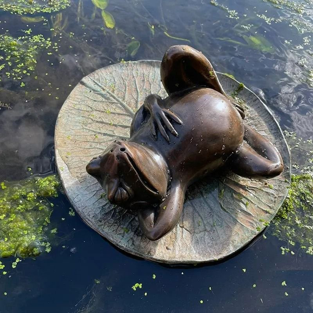 Bronze Frog on Lily Pad Garden Ornament showing a relaxed frog reclining on a detailed lily pad