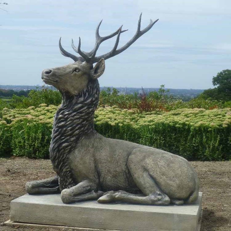 Bronze Large Stag Garden Statue showing a majestic Scottish Red Deer Stag resting gracefully with detailed antlers