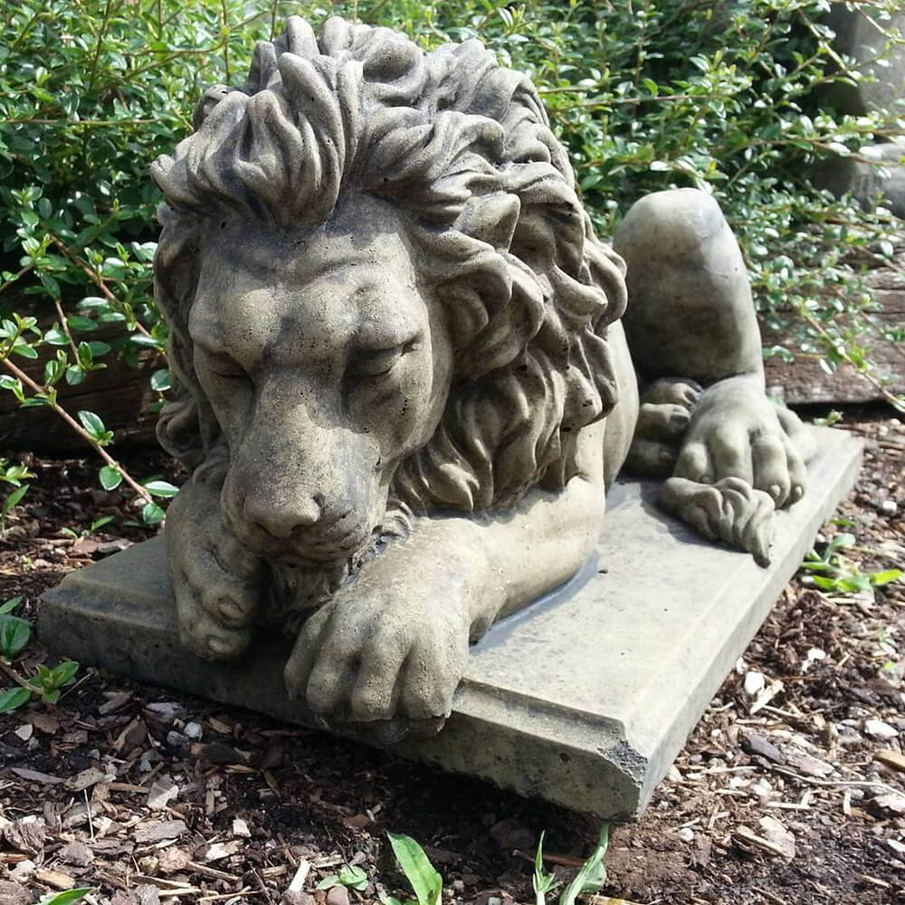 Close-up of a marble-style Sleeping Lion Sculpture