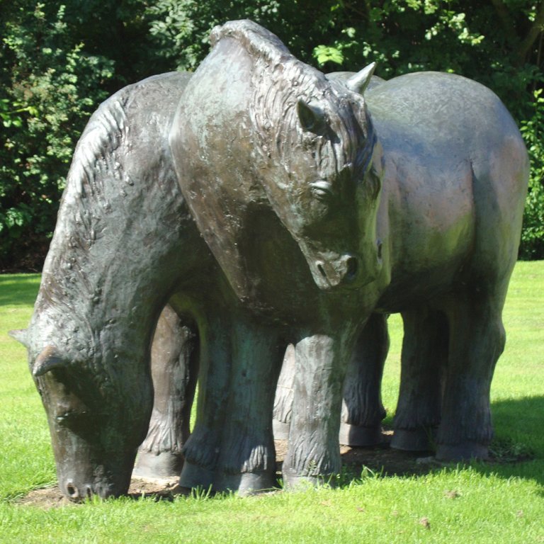 Draft Horse Statue in bronze depicting two strong horses grazing peacefully