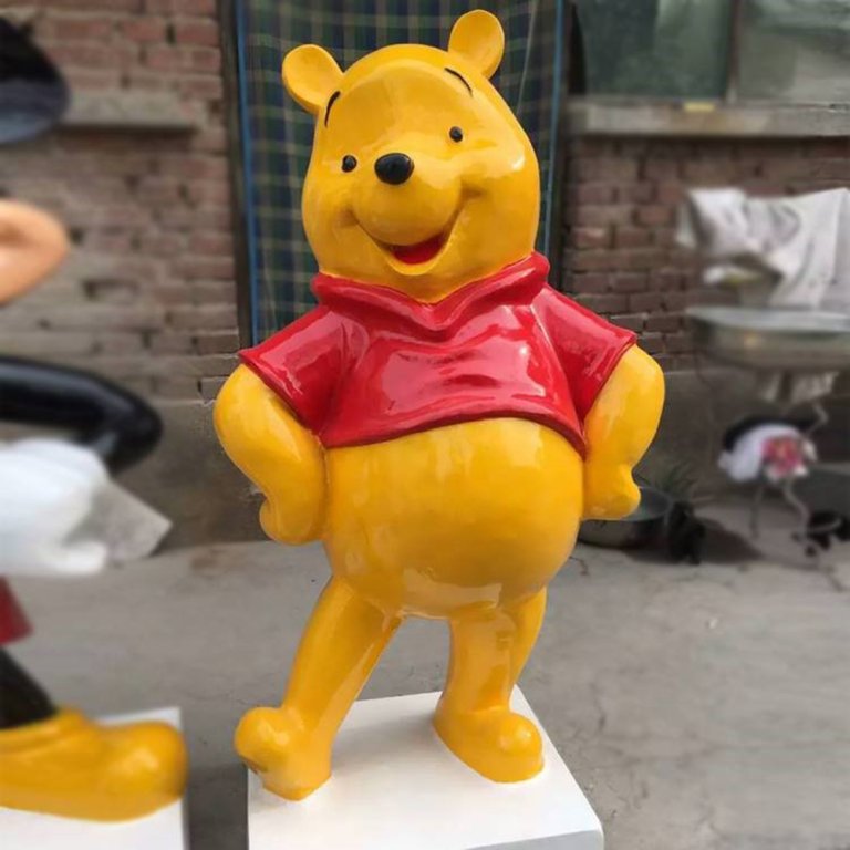 Fiberglass Disney Winnie the Pooh Statue with bright yellow body and red shirt