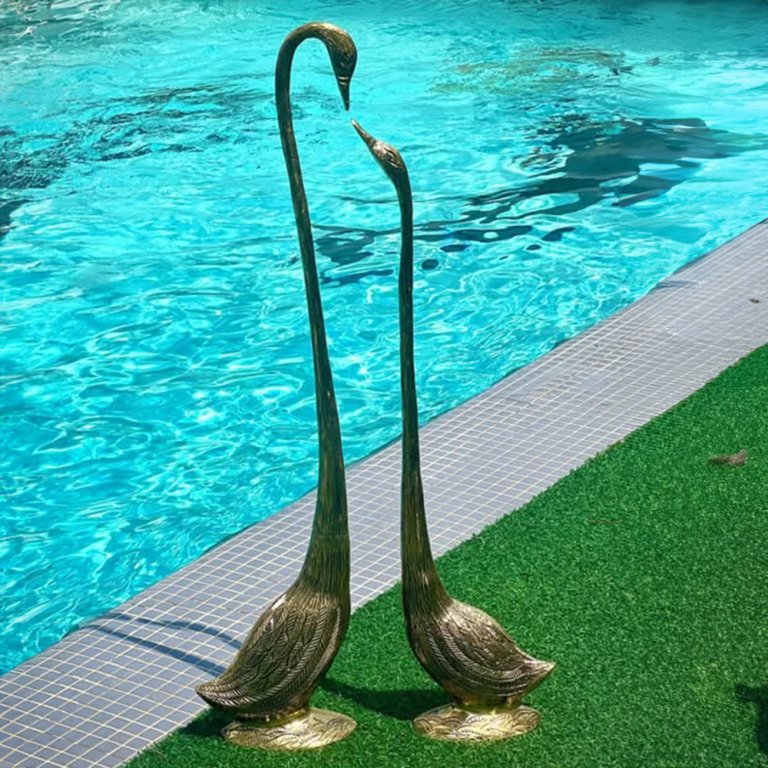 Garden Crane Sculpture in bronze featuring two elegant cranes standing side by side