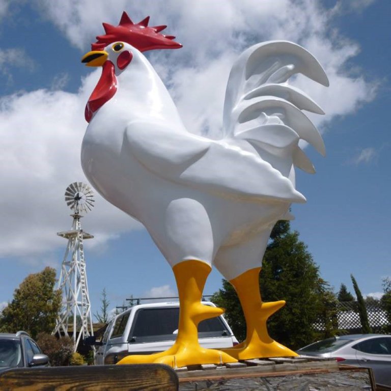 Outdoor fiberglass Large Rooster Sculpture featuring vivid colors and bold design