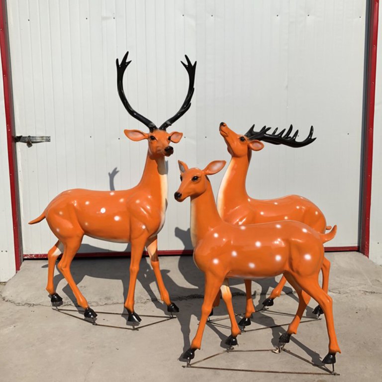 Life Size Deer Yard Ornaments in fiberglass showing a group of lifelike sika deer with smooth orange-brown finish