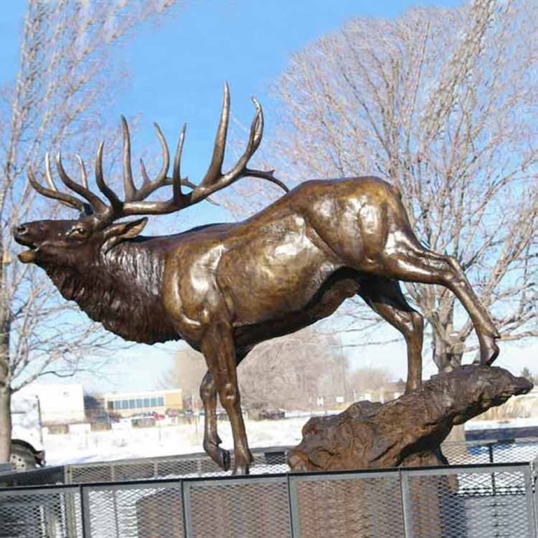 Life Size Moose Statue for Sale in bronze showing a powerful moose standing on a rock base