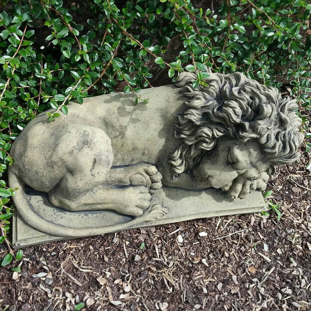 Stone Sleeping Lion Sculpture resting peacefully