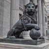 bronze Lion Gate Statue depicting a majestic lion with one paw resting on a ball
